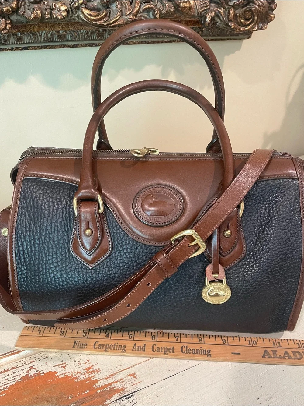 Dooney & Bourke vintage AWL Black and Brown Pebbled Leather Satchel / crossbody